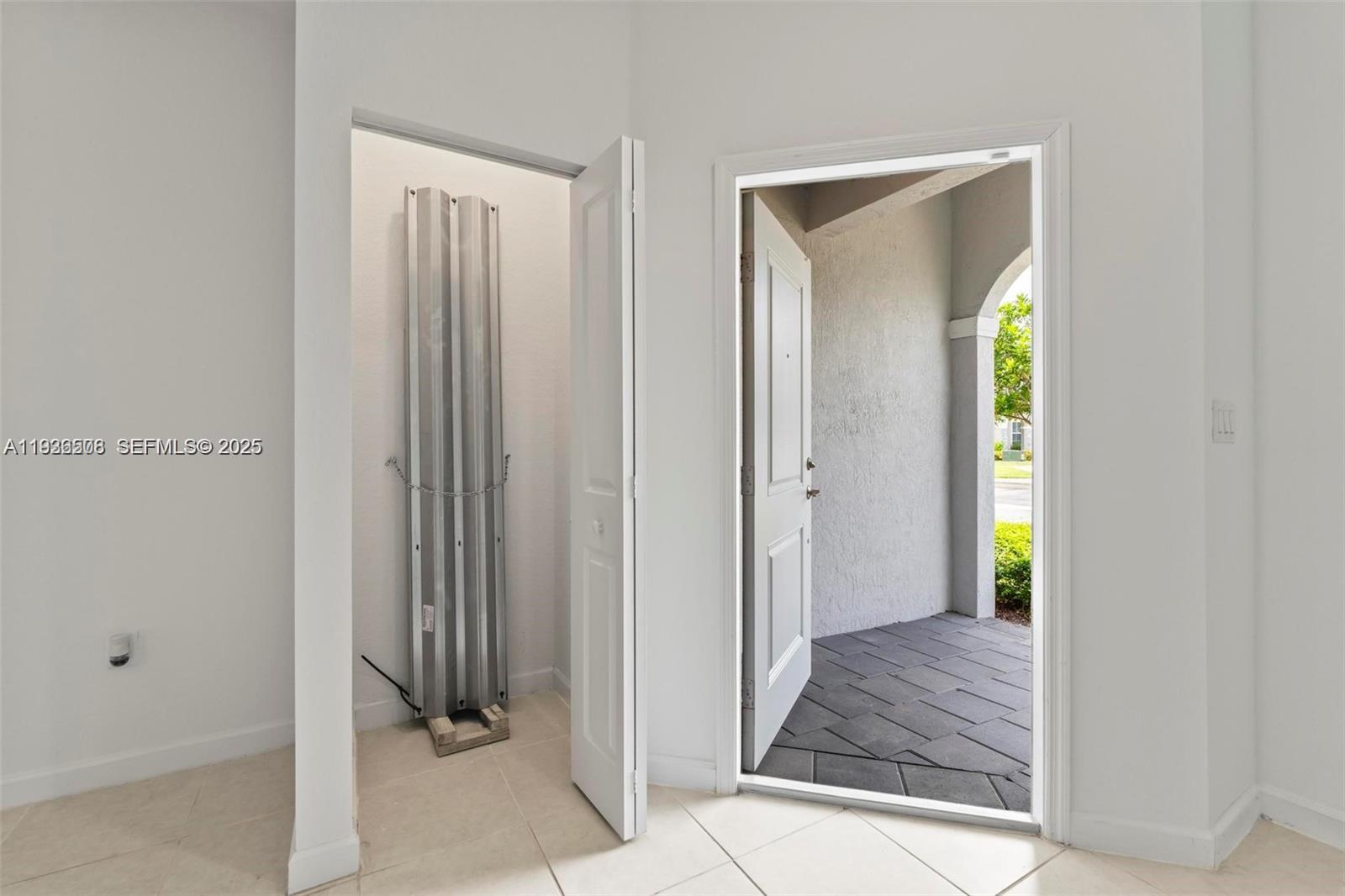 2668 Southeast 19th Street Homestead, FL 33035 - Photo 9 of 37 a view of an entryway with wooden floor
