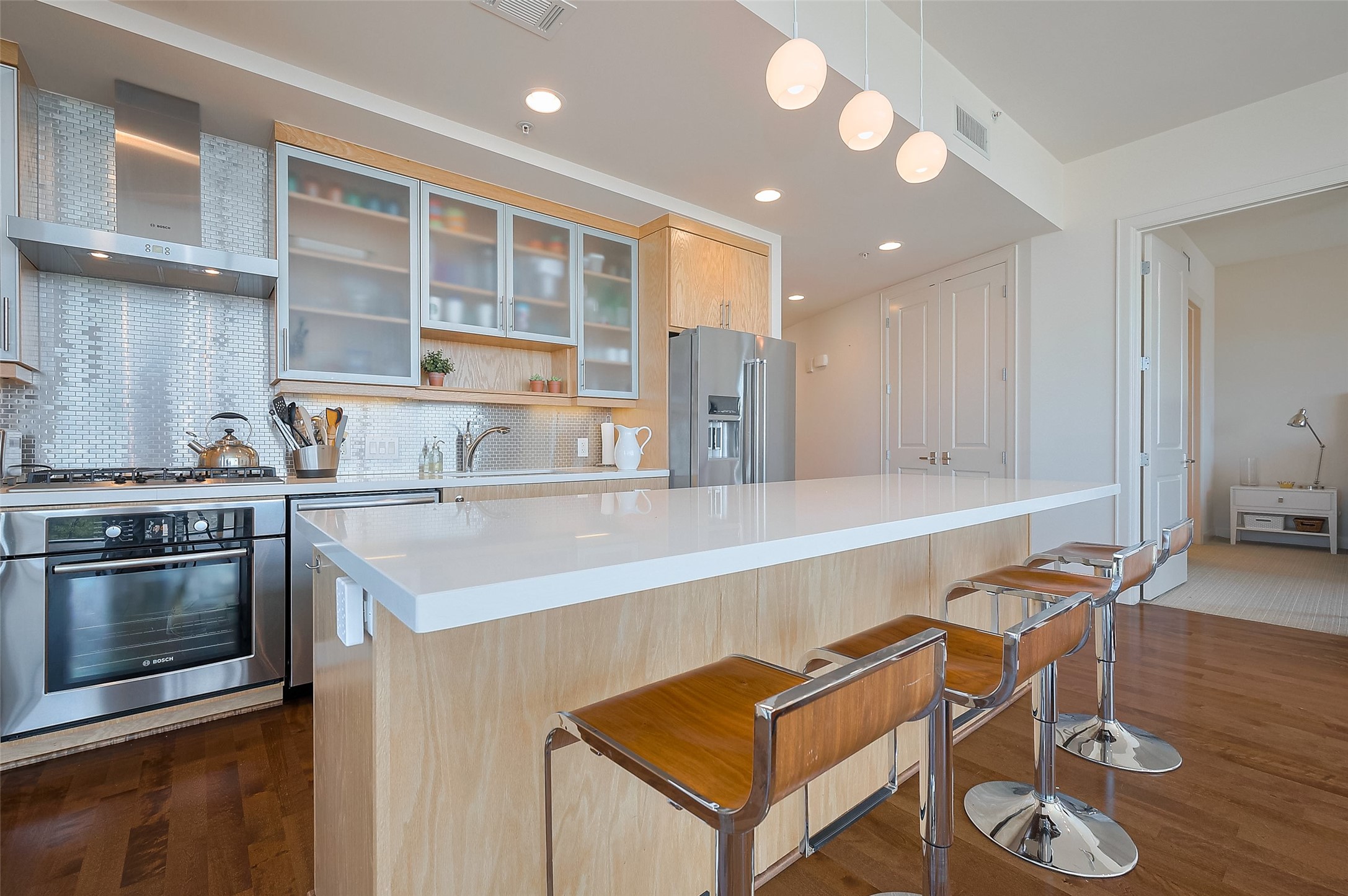 2207 Bancroft Lane, Unit 604 Houston, TX 77027 - Photo 12 of 40 a kitchen with a sink cabinets and wooden floor
