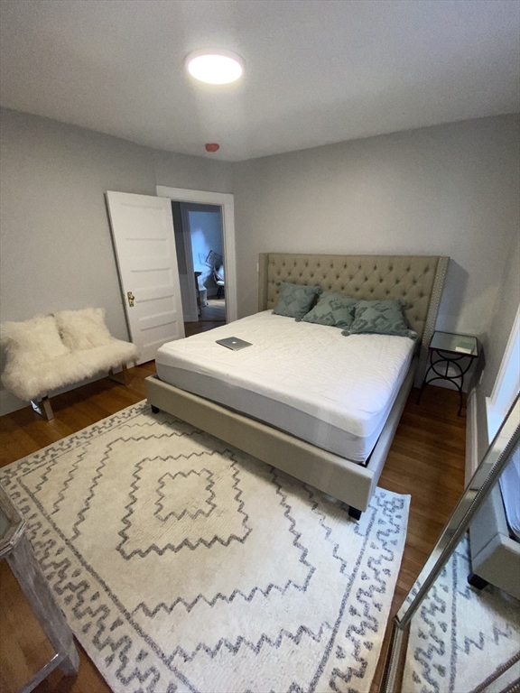 79 Brook Street, Unit 2R Brookline, MA 02445 - Photo 3 of 3 a bed sitting in a bedroom and furniture