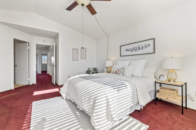 a bedroom with a bed and a table