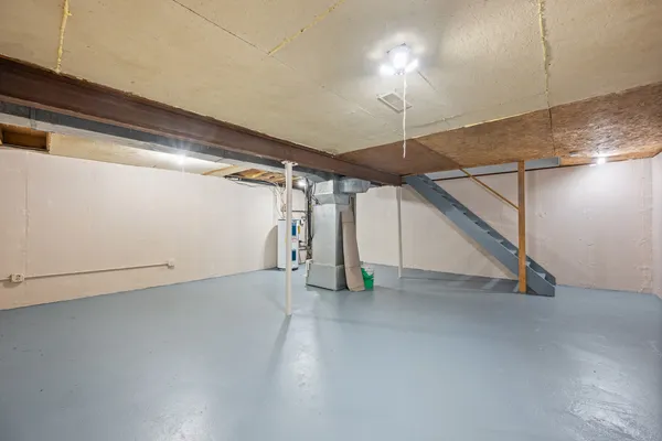 a view of an empty room with stairs