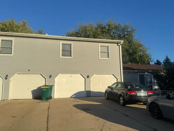 a view of a car parked in front of a house