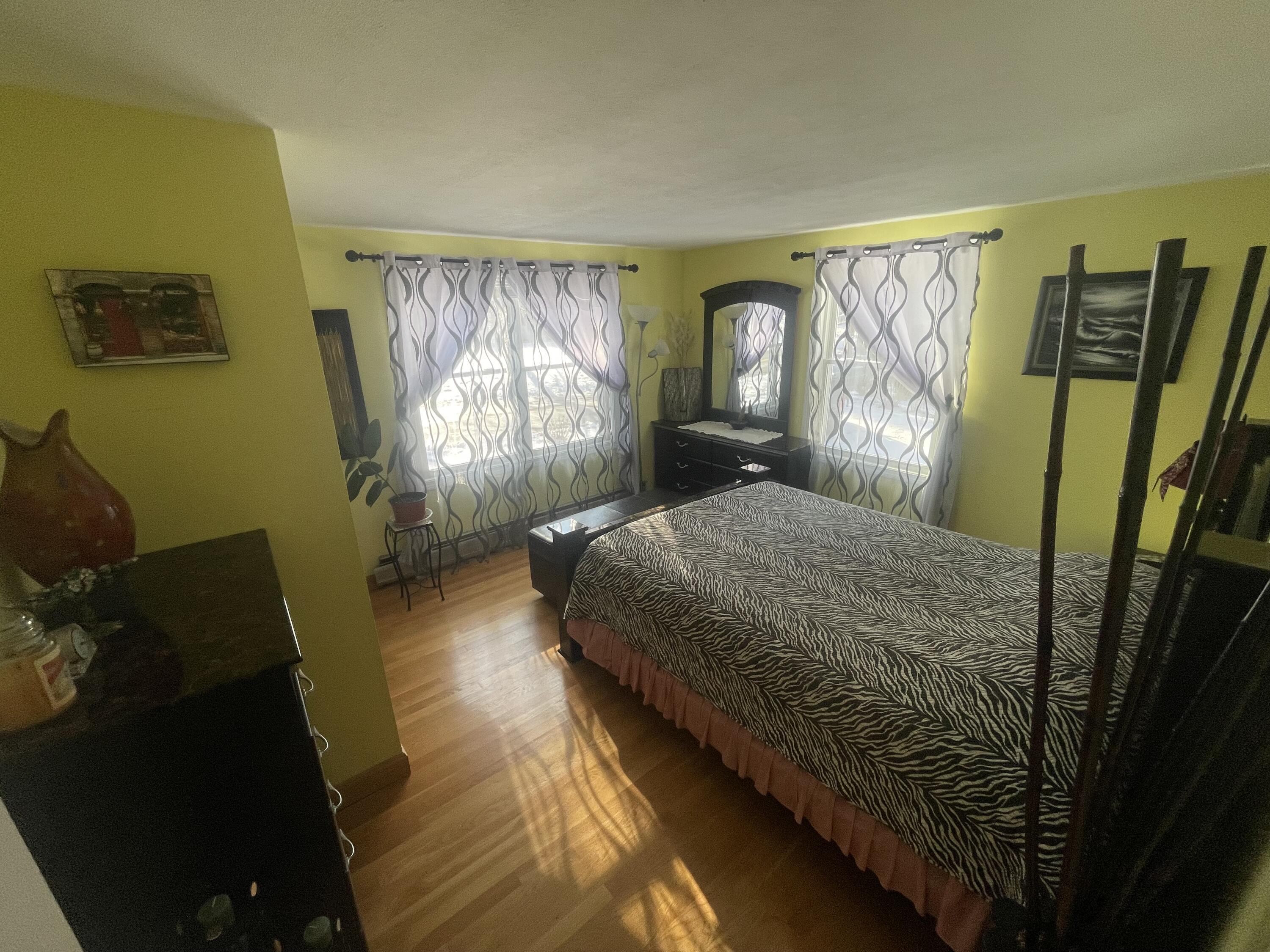 8 Scraggy Neck Rd Extension Cataumet, MA 02534 - Photo 16 of 19 a bedroom with a bed and a window