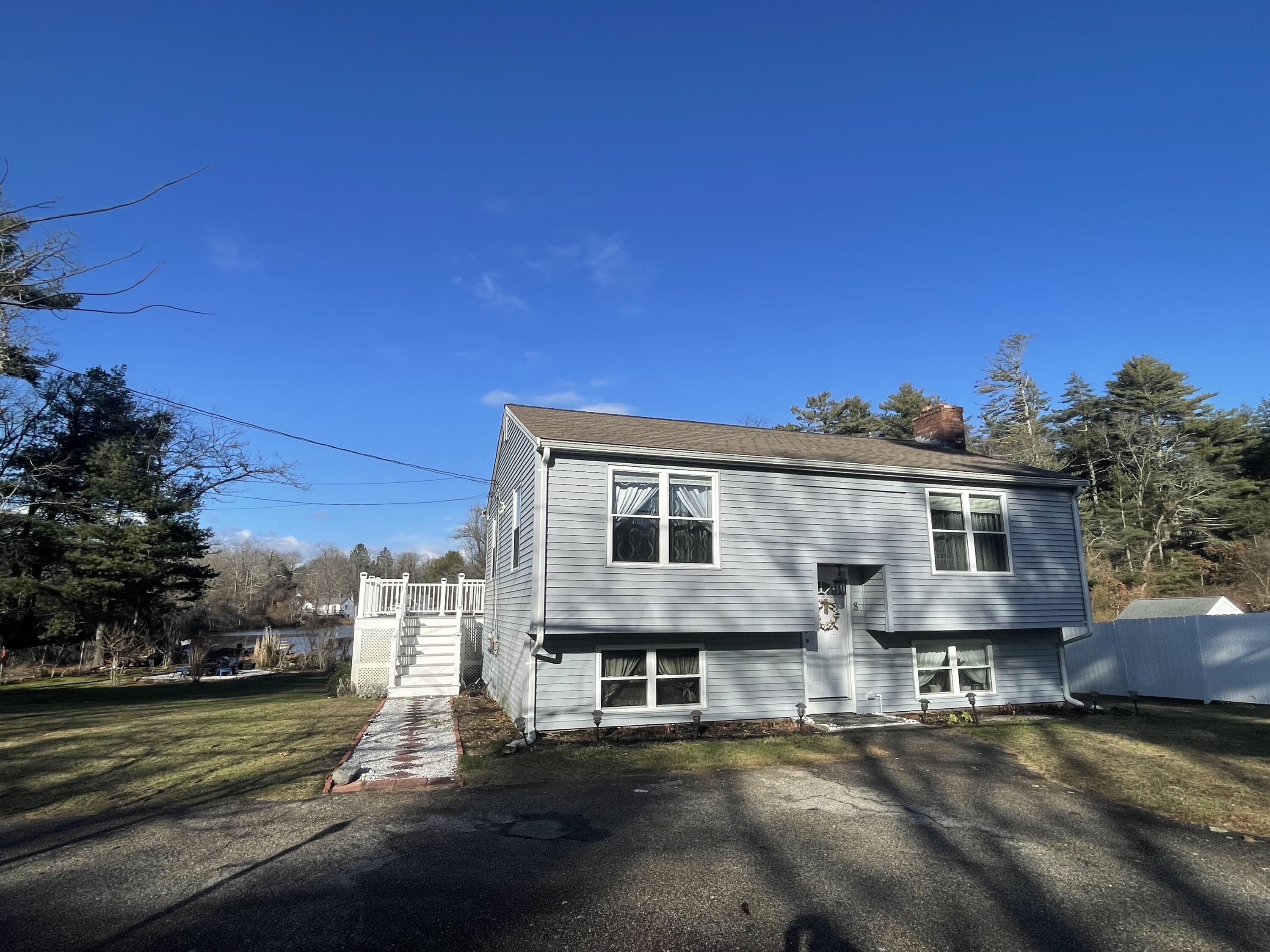 8 Scraggy Neck Rd Extension Cataumet, MA 02534 - Photo 2 of 19 a front view of a house with a yard