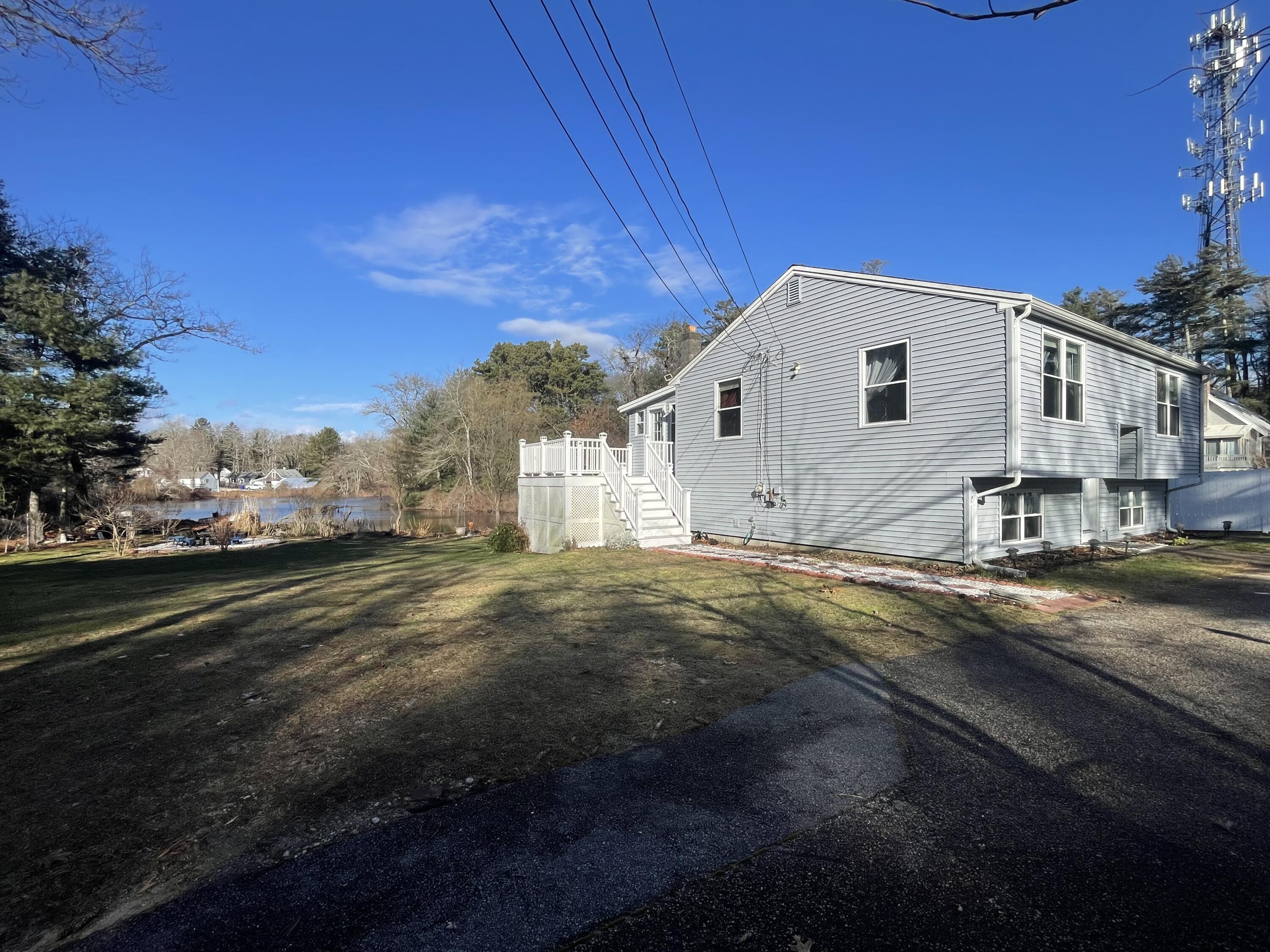 8 Scraggy Neck Rd Extension Cataumet, MA 02534 - Photo 3 of 19 a view of a house with a yard