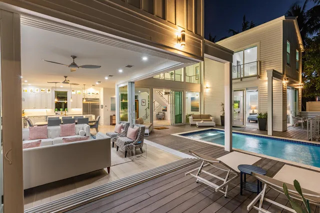 a living room with furniture a window and a lamp