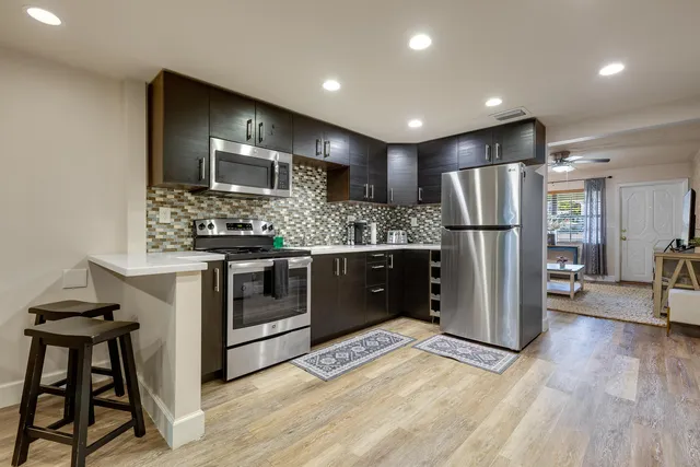 a living room with a bed furniture and a window