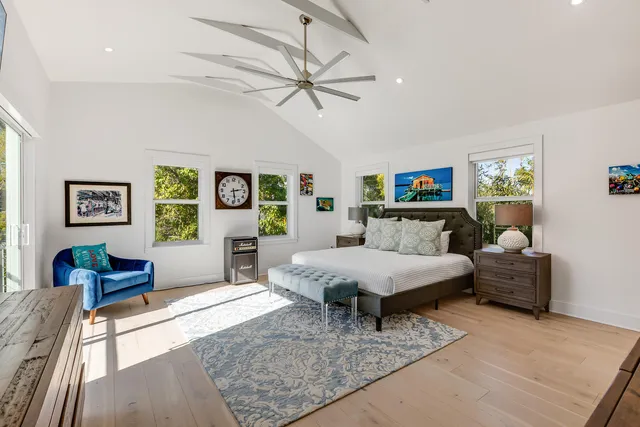 a bedroom with a large bed and a couch