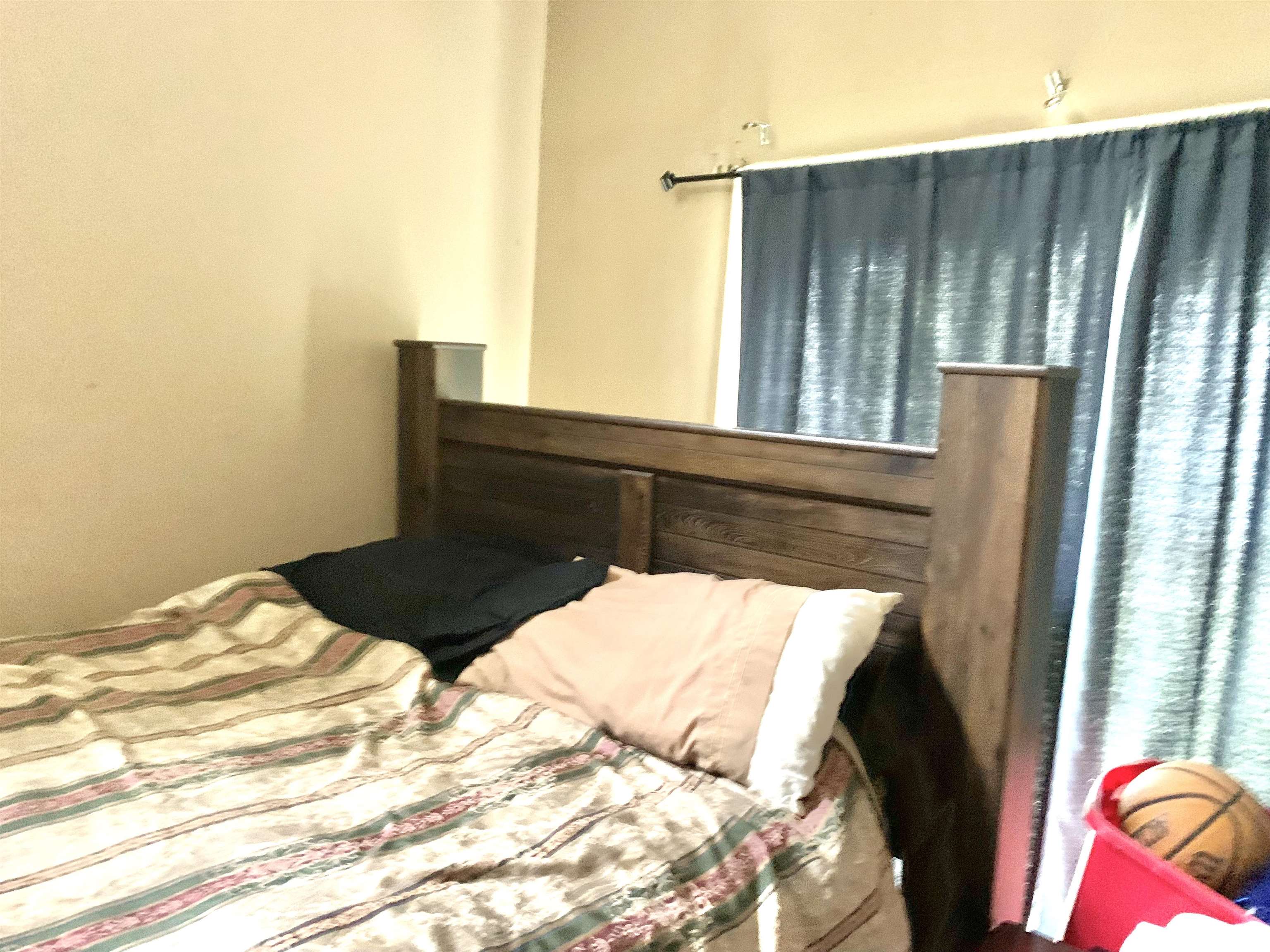 654 Harding Street Wichita, KS 67208 - Photo 15 of 25 Bedroom #3 has been converted from family room. Vaulted ceilings.