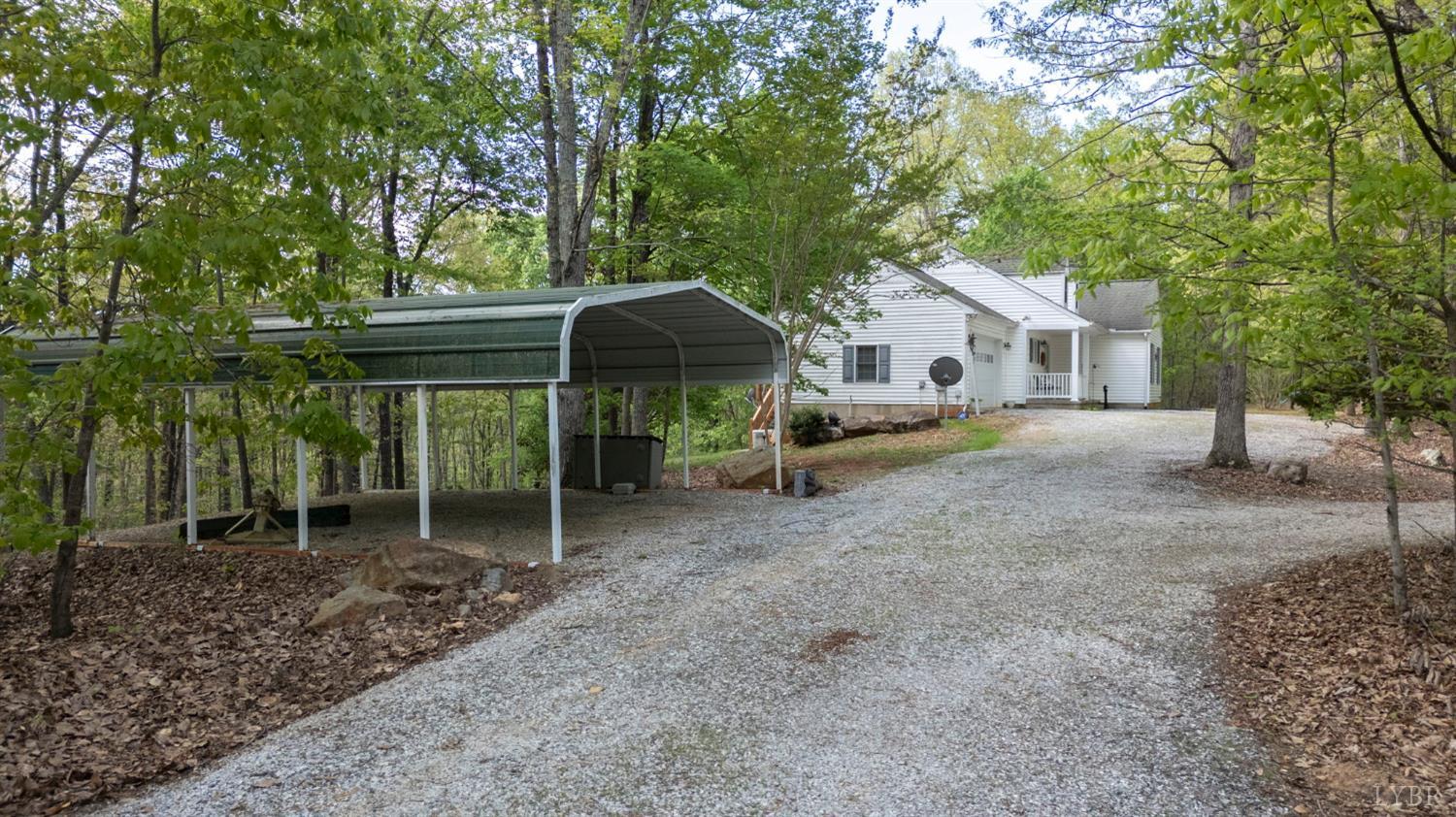 298 Braxton Ridge Road Amherst, VA 24521 - Photo 47 of 65 a view of a house with a yard and large trees