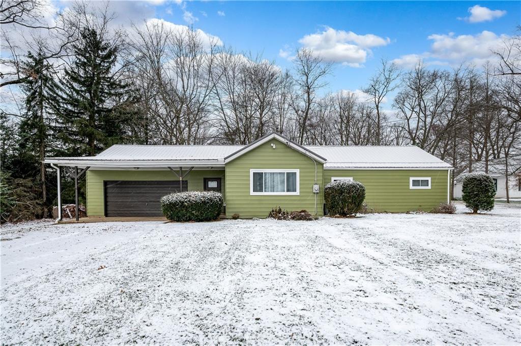 222 Dick Road Prospect, PA 16052 - Photo 1 of 29 a front view of a house with a yard and garage