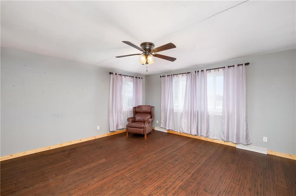 222 Dick Road Prospect, PA 16052 - Photo 17 of 29 an empty room with wooden floor and windows