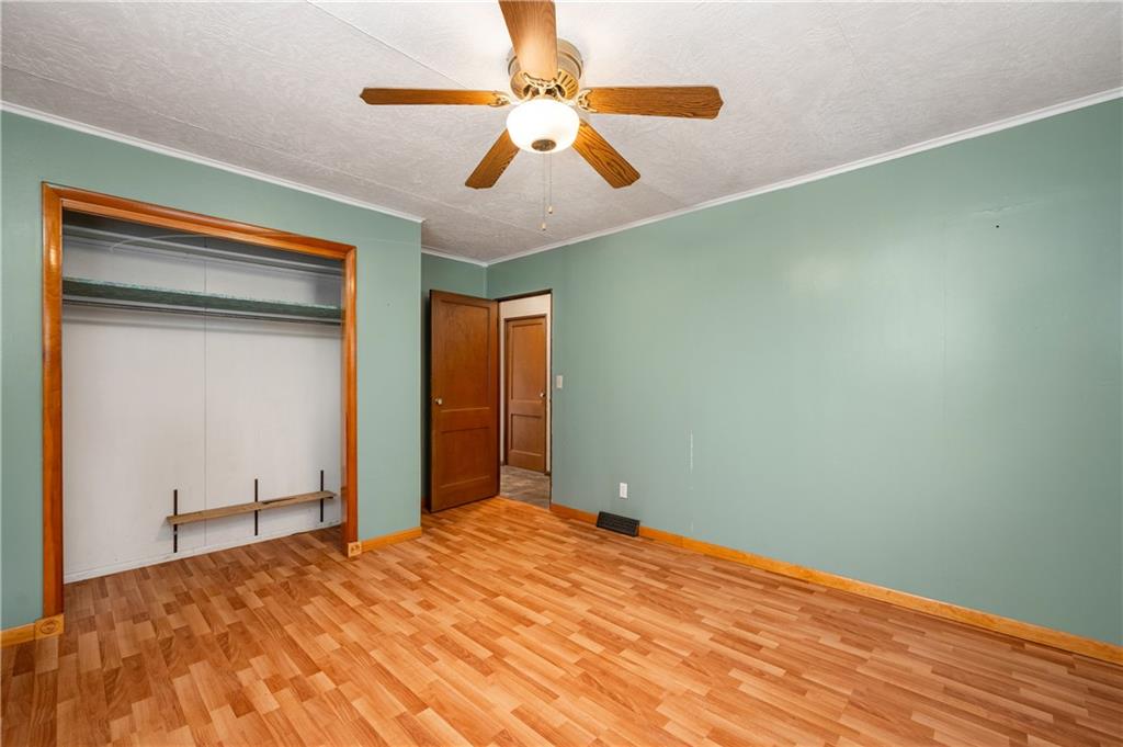 222 Dick Road Prospect, PA 16052 - Photo 22 of 29 a bedroom with a bed and a ceiling fan