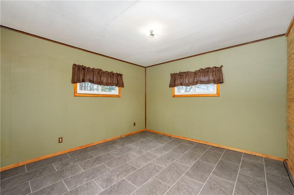222 Dick Road Prospect, PA 16052 - Photo 24 of 29 an empty room with a painting on the wall