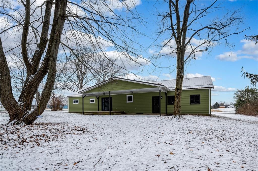 222 Dick Road Prospect, PA 16052 - Photo 27 of 29 a front view of a house with a yard and large tree