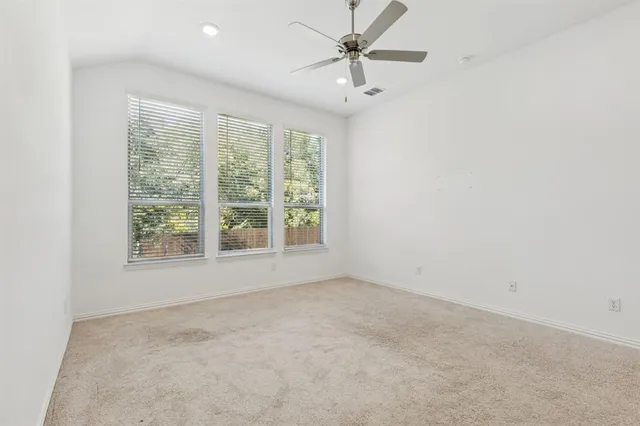 an empty room with a empty space and a window