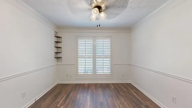 a large kitchen with stainless steel appliances granite countertop a lot of counter space and wooden floor