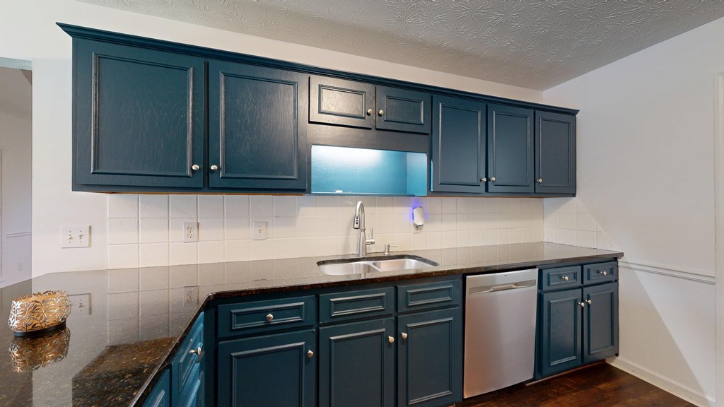 1278 Jones Road Cataula, GA 31804 - Photo 21 of 94 a kitchen with a sink cabinets and wooden floor