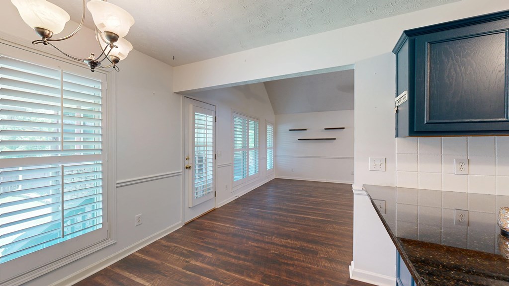 1278 Jones Road Cataula, GA 31804 - Photo 25 of 94 a view of an empty room with wooden floor and a window