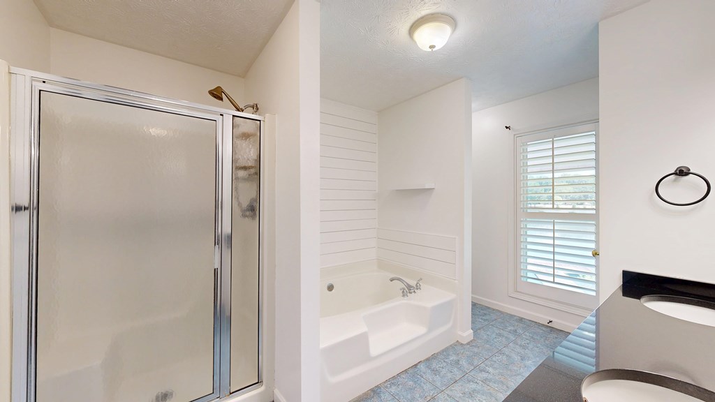 1278 Jones Road Cataula, GA 31804 - Photo 32 of 94 a bathroom with a tub shower and sink