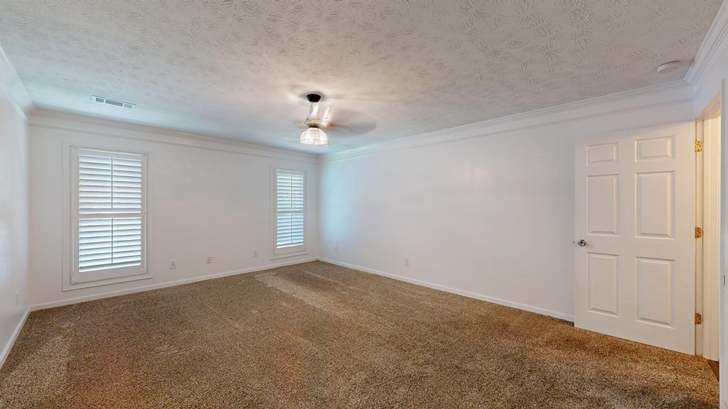 1278 Jones Road Cataula, GA 31804 - Photo 35 of 94 an empty room with windows and chandelier fan