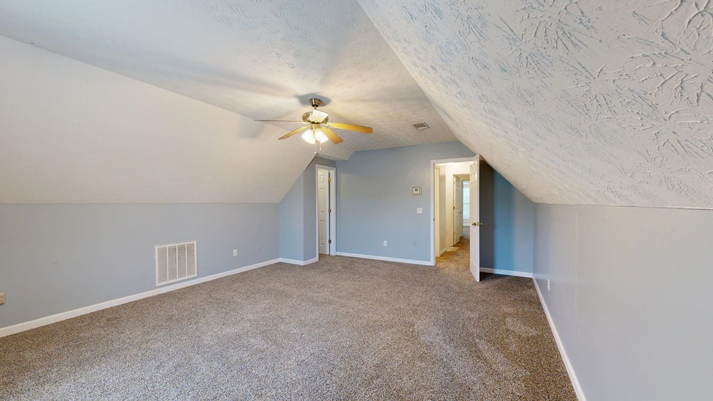 1278 Jones Road Cataula, GA 31804 - Photo 40 of 94 a view of an empty room with a chandelier fan