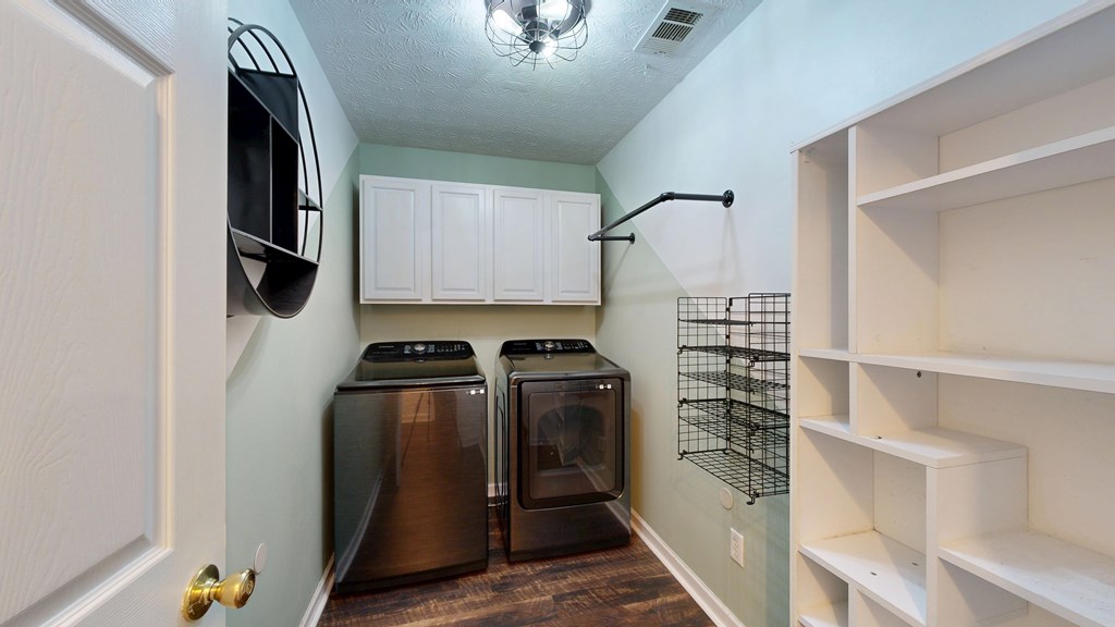 1278 Jones Road Cataula, GA 31804 - Photo 52 of 94 a kitchen with a refrigerator and a stove top oven