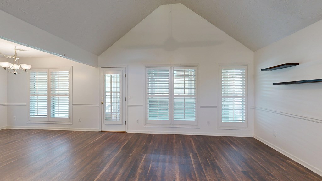 1278 Jones Road Cataula, GA 31804 - Photo 6 of 94 an empty room with wooden floor and windows
