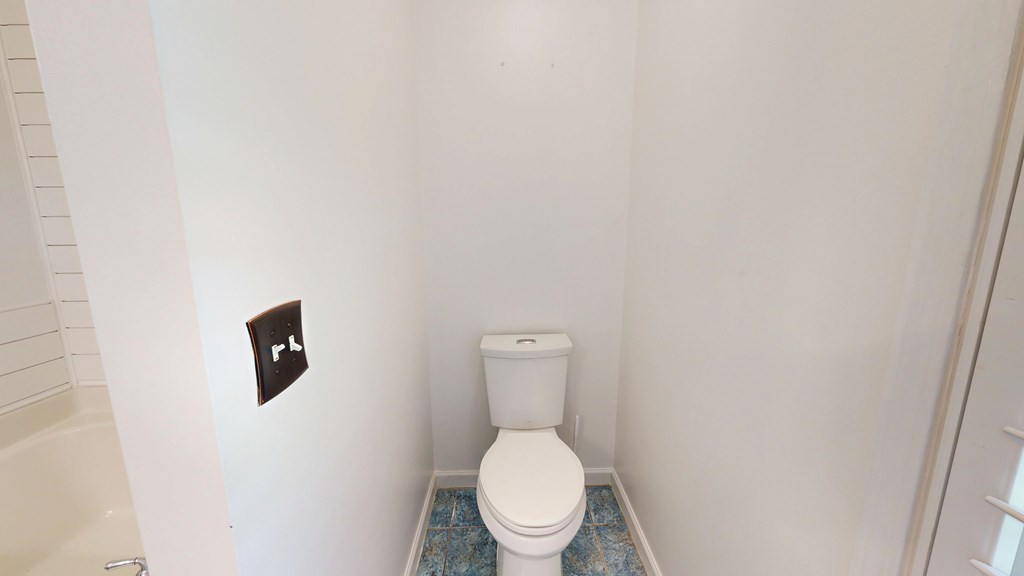 1278 Jones Road Cataula, GA 31804 - Photo 66 of 94 a white toilet sitting next to a white wall