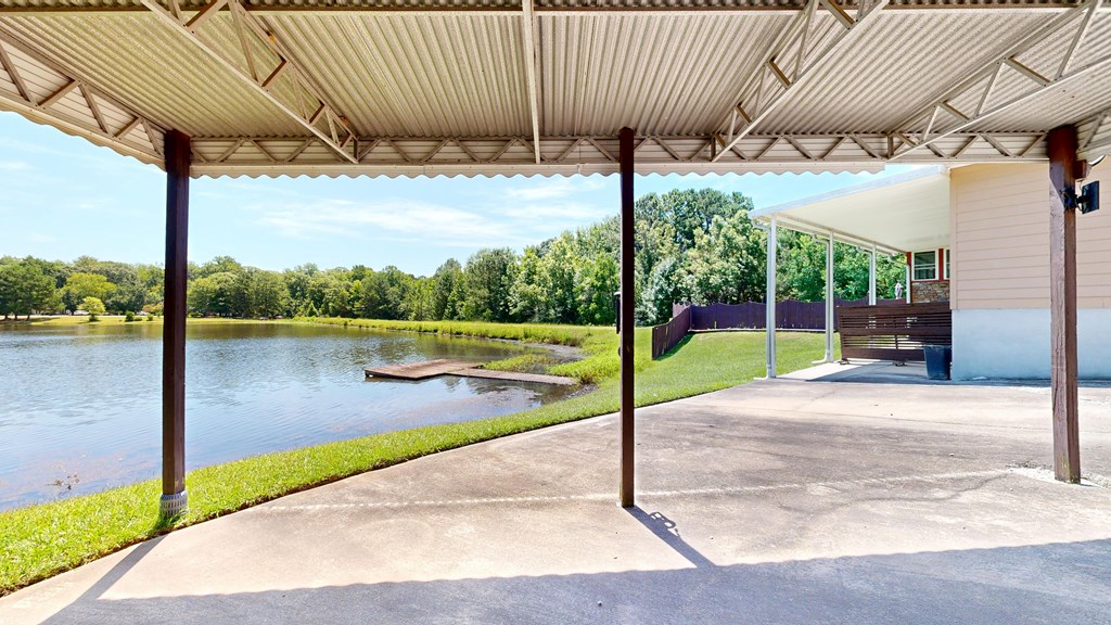 1278 Jones Road Cataula, GA 31804 - Photo 79 of 94 a view of a patio with table and chairs next to a yard