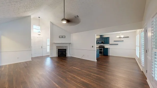 a kitchen with stainless steel appliances and wooden cabinets