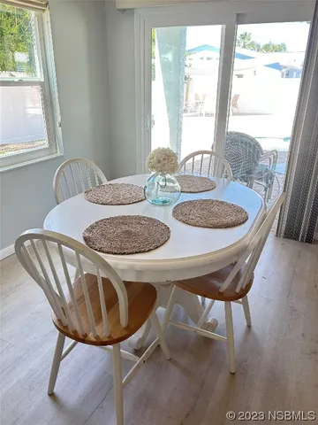 a dining room with furniture and window