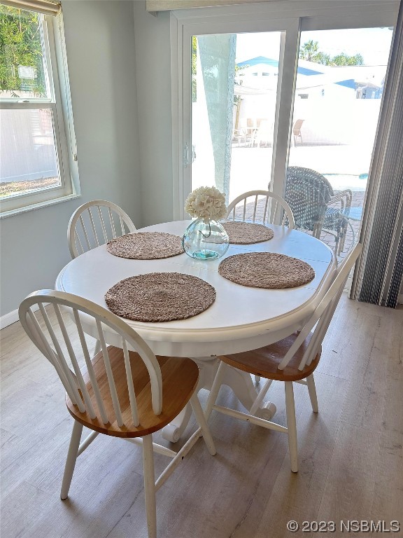910 Maple Street, Unit A New Smyrna Beach, FL 32169 - Photo 12 of 18 a dining room with furniture and window