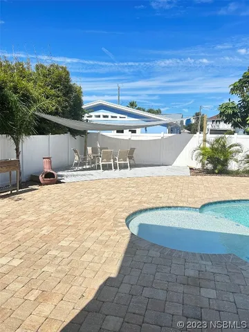 a view of a swimming pool with an outdoor space
