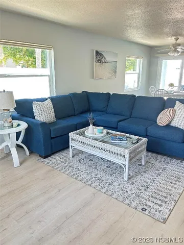 a living room with furniture and a rug