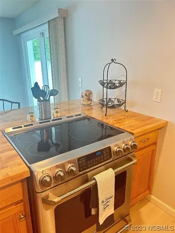 a close view of a sink a counter space and utility room