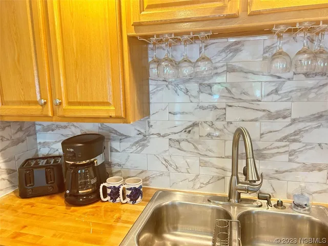 a close view of a sink and dishwasher