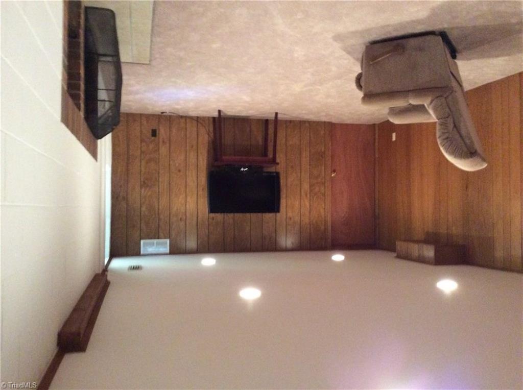 335 Doub Road Lewisville, NC 27023 - Photo 20 of 27 Downstairs media room. With second fireplace not included in square footage
