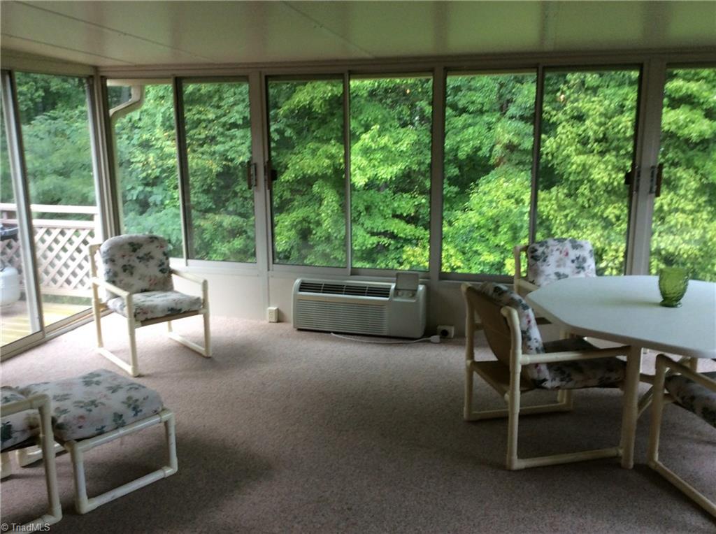 335 Doub Road Lewisville, NC 27023 - Photo 6 of 27 Large sun room for enjoying morning breakfast and a deck for grilling out in the evening.