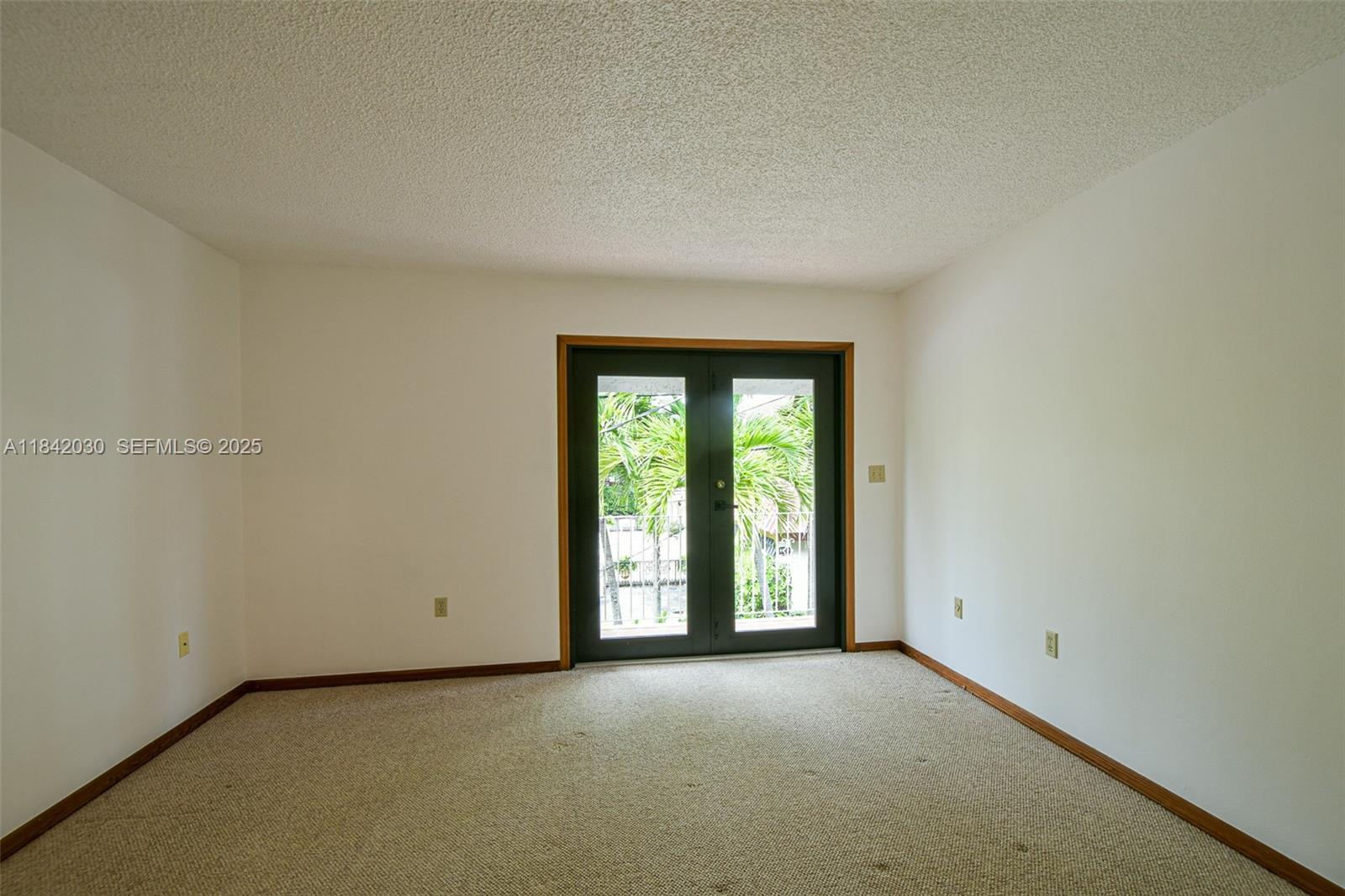 3542 Southwest 17th Street, Unit 2B Miami, FL 33145 - Photo 13 of 25 an empty room with windows