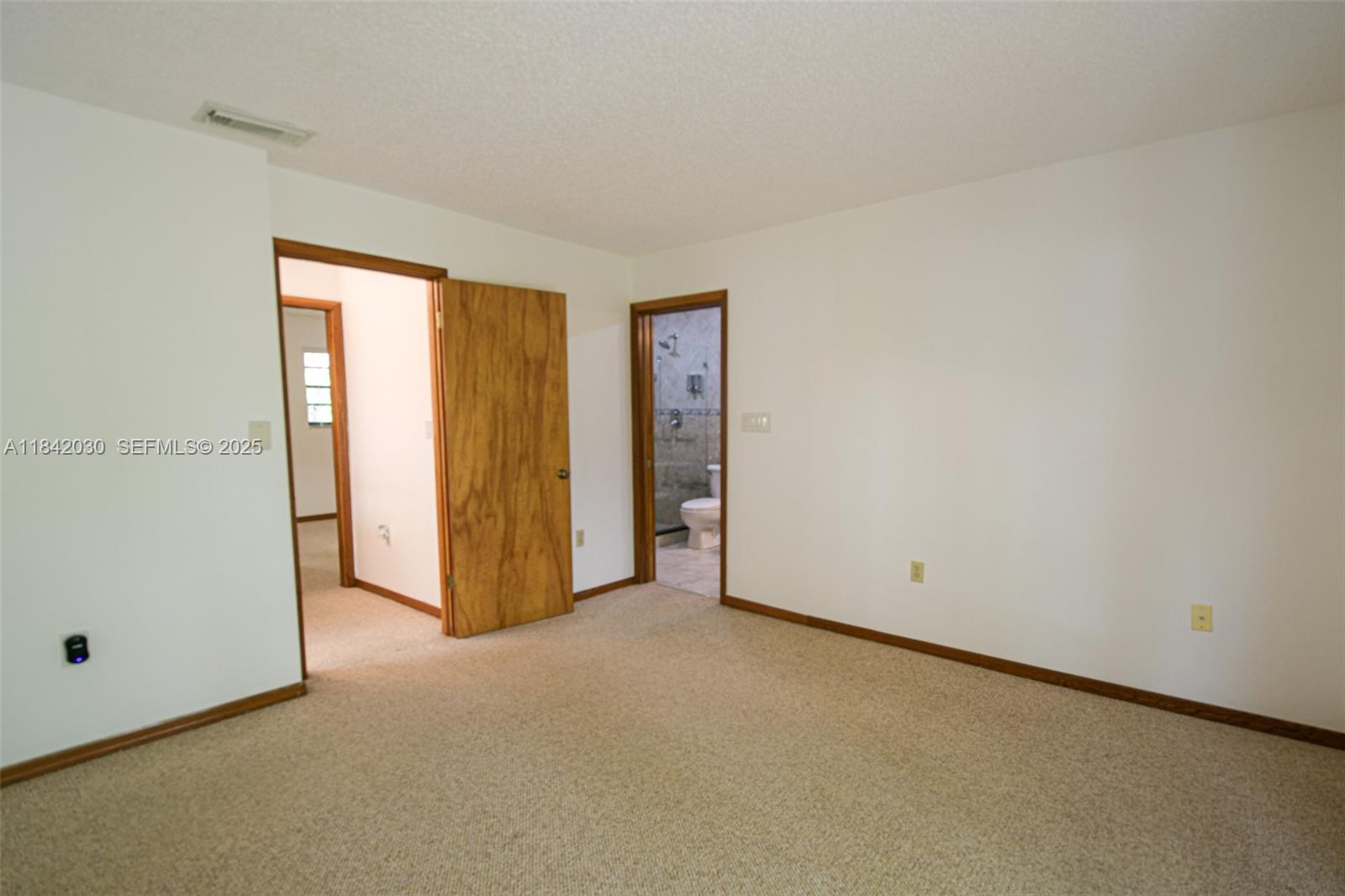 3542 Southwest 17th Street, Unit 2B Miami, FL 33145 - Photo 15 of 25 an empty room with closet