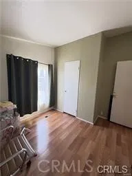 a view of a livingroom with wooden floor