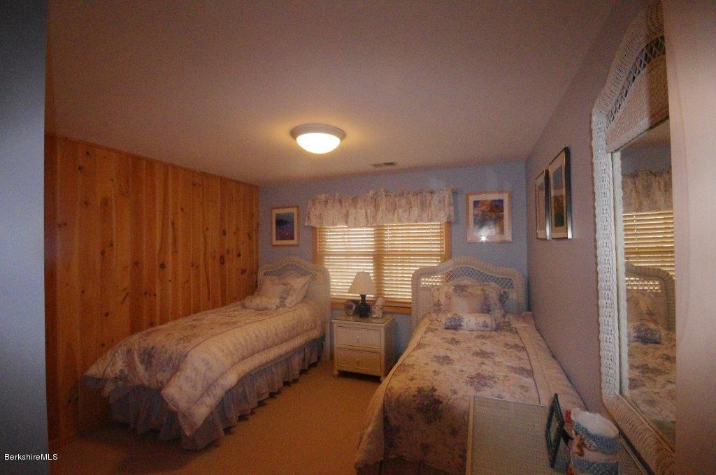 111 Hupi Road Monterey, MA 01245 - Photo 14 of 17 a spacious bedroom with two beds and large windows