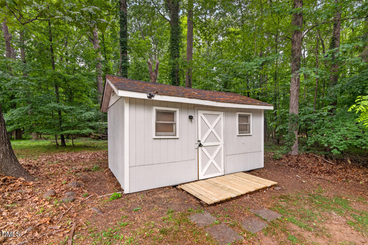 1420 Goodwin Road Durham, NC 27712 - Photo 43 of 54 a view of a house with a yard