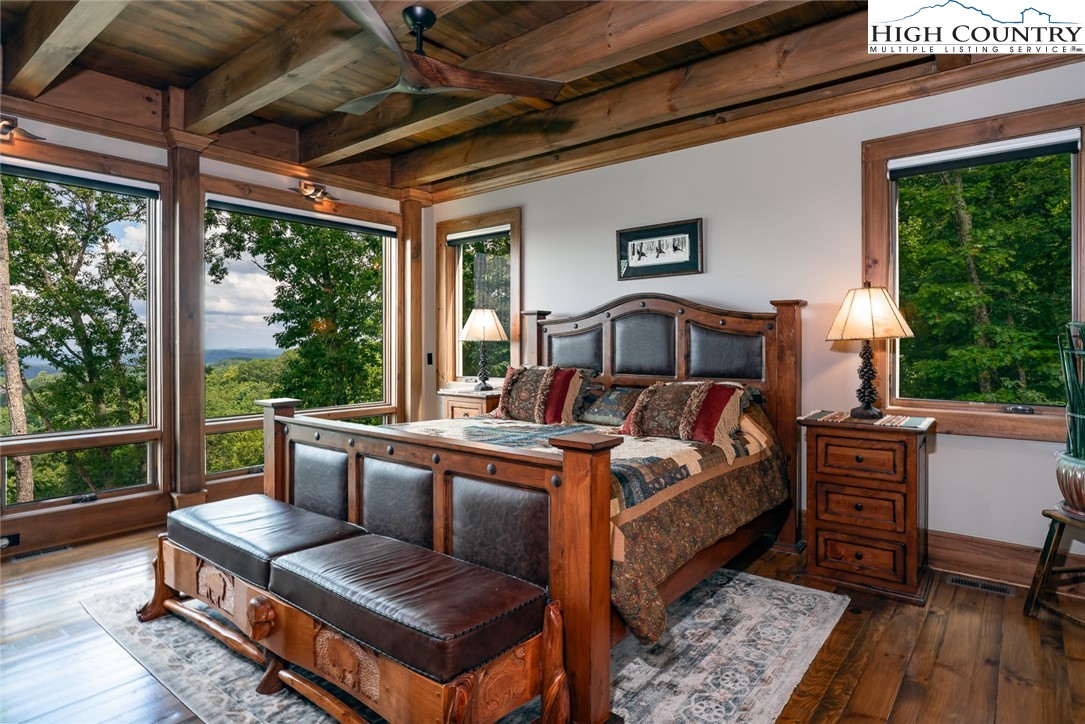 550 Pepperroot Road Boone, NC 28607 - Photo 13 of 50 a bed room with a bed and a chair