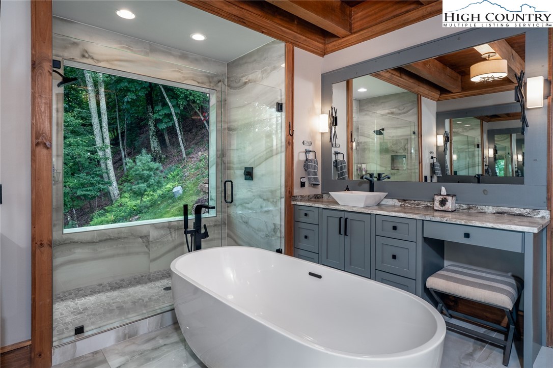 550 Pepperroot Road Boone, NC 28607 - Photo 16 of 50 a bathroom with a large tub and sink