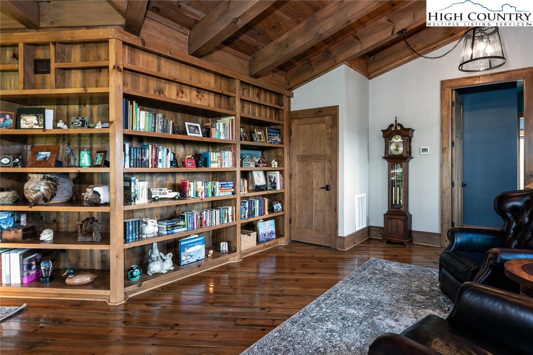 550 Pepperroot Road Boone, NC 28607 - Photo 21 of 50 a view of room with bookshelf and wooden floor