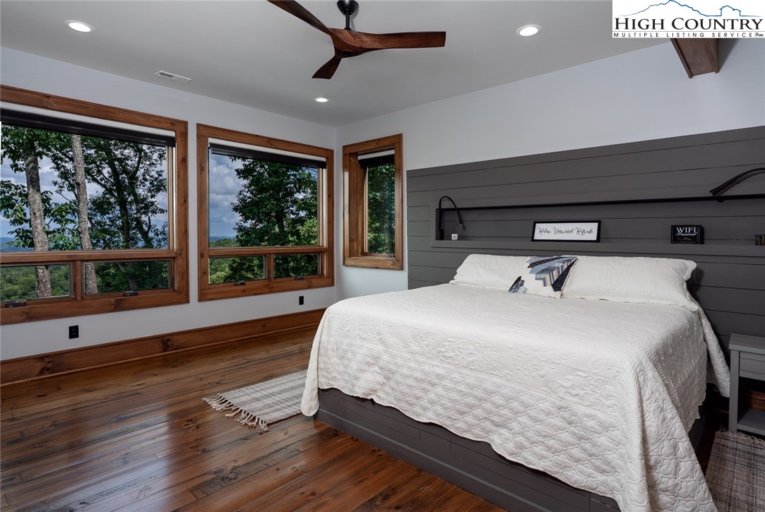 550 Pepperroot Road Boone, NC 28607 - Photo 27 of 50 a bedroom with a large bed and a large window