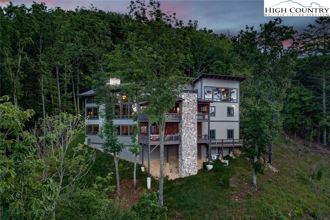 550 Pepperroot Road Boone, NC 28607 - Photo 3 of 50 a view of a house with a yard and sitting area