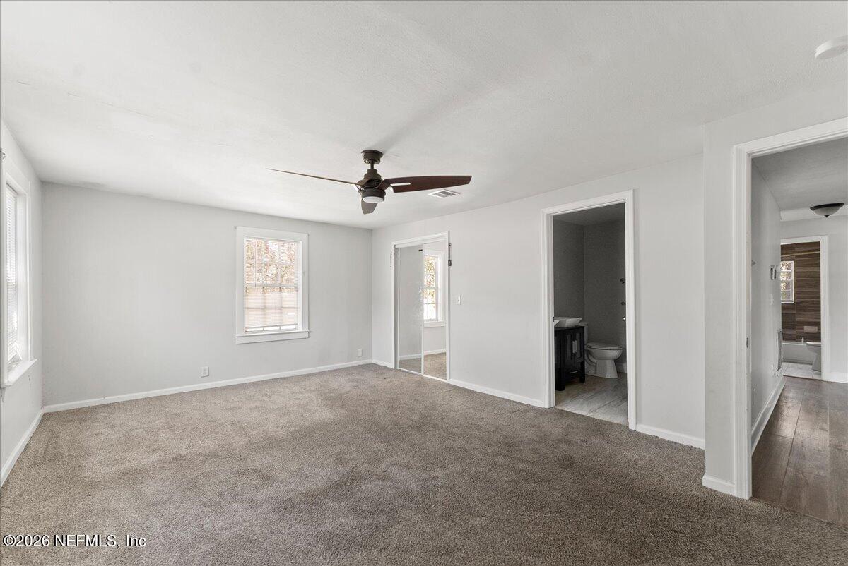 10565 Bessent Road North Jacksonville, FL 32218 - Photo 18 of 27 a view of a livingroom with a ceiling fan and window